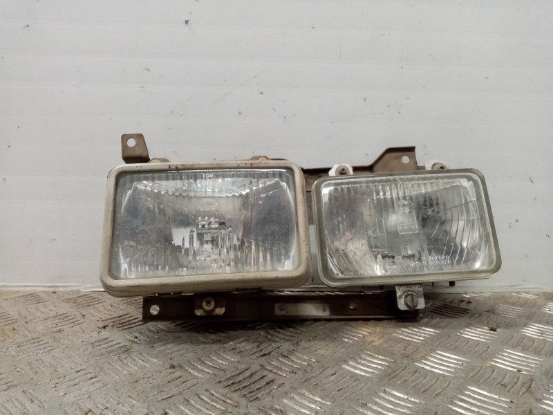 Recambio de faro izquierdo para nissan vanette (c 220) vanette transporter referencia OEM IAM   