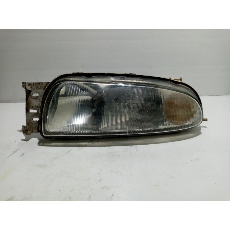 Recambio de faro izquierdo para ford fiesta berlina referencia OEM IAM 0301049201  