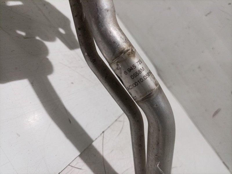 Recambio de tubo aire acondicionado para bmw x5 (e70) 3.0 d referencia OEM IAM 6945725  