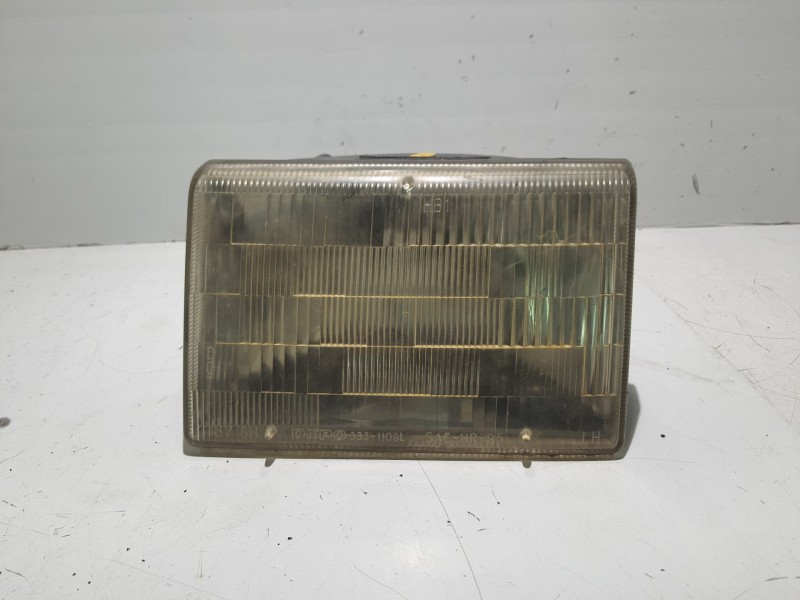 Recambio de faro izquierdo para jeep cherokee (xj) 2.5 td referencia OEM IAM 55054833  