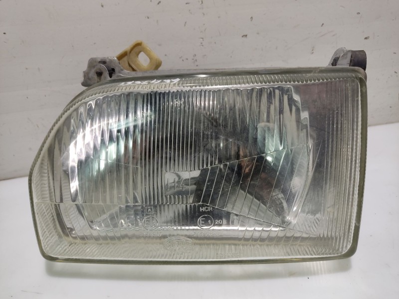 Recambio de faro izquierdo para ford orion referencia OEM IAM 1058202  