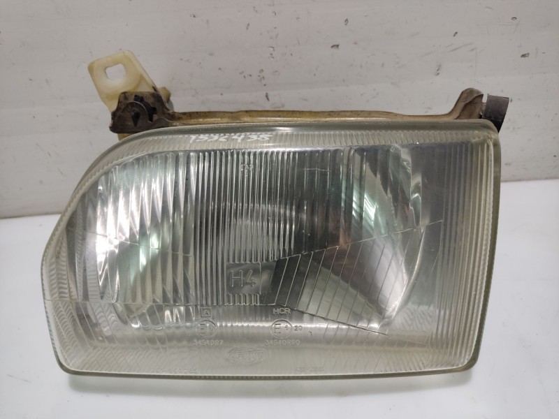 Recambio de faro izquierdo para ford orion referencia OEM IAM 1058202  