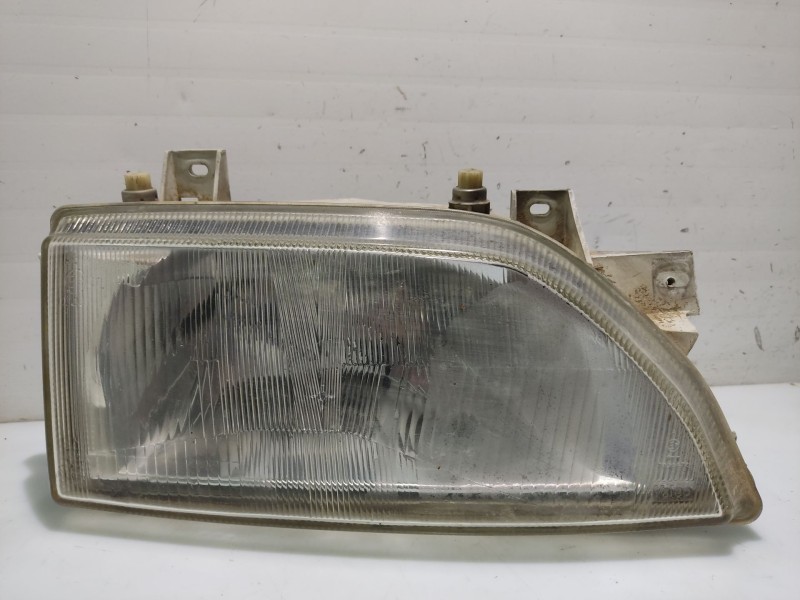 Recambio de faro derecho para ford escort berlina referencia OEM IAM 6194029  