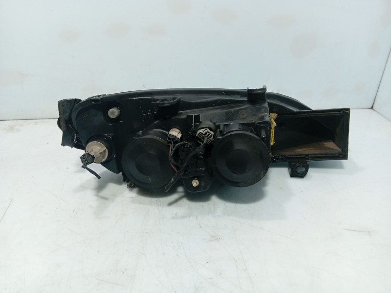 Recambio de faro izquierdo para nissan primera hatchback (p11) 1.6 16v referencia OEM IAM 26060AU80B  
